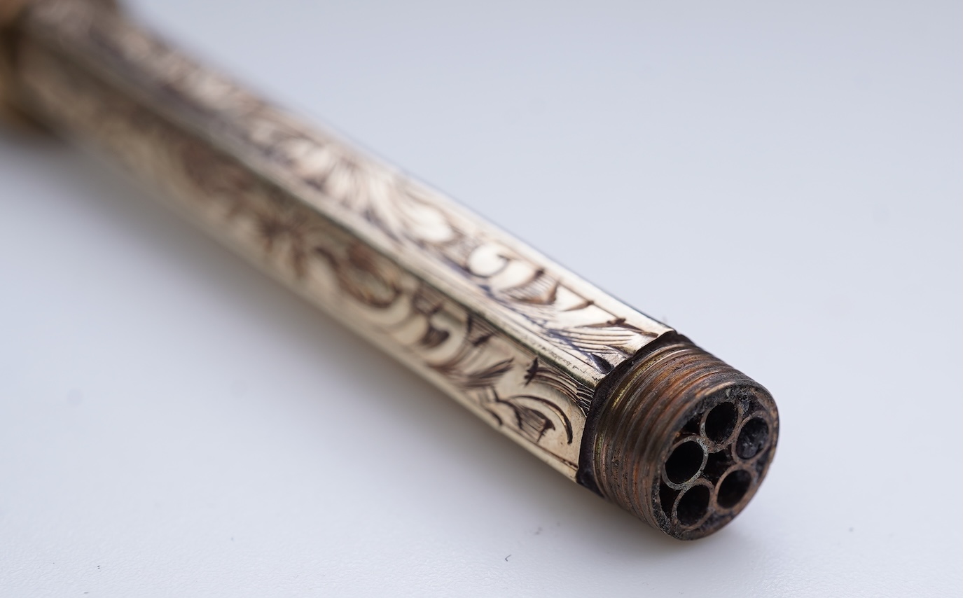 An early Victorian gold and amethyst mechanical pencil, mid 19th century